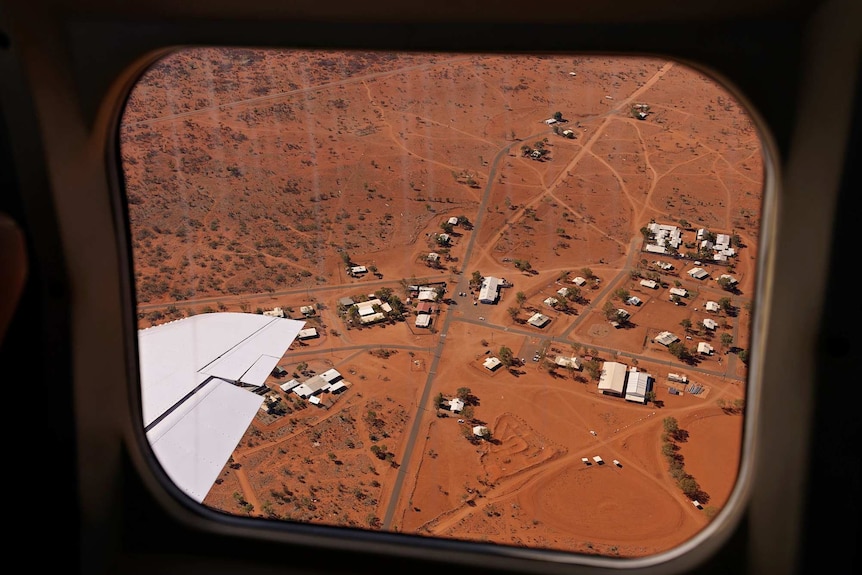 The community of Docker River is seen from the window of an airplane.