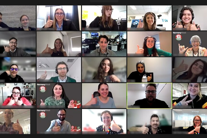 Virtual meeting screenshot of lots of happy smiling faces. Some people are giving a thumbs up.