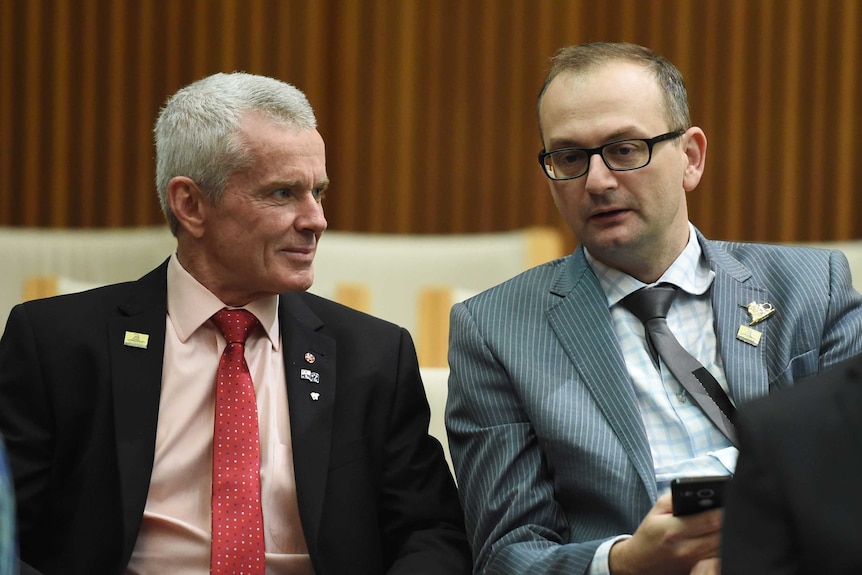 Malcolm Roberts speaking with advisor Sean Black at a press conference in Parliament House, Canberra