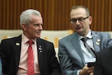 Malcolm Roberts speaking with advisor Sean Black at a press conference in Parliament House, Canberra