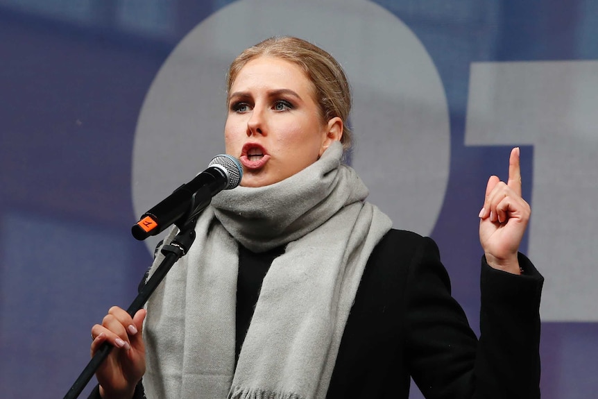 Russian opposition activist Lyubov Sobol speaks into a microphone.