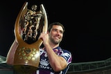 Glory for Melbourne captain Cameron Smith as he poses with the premiership trophy.