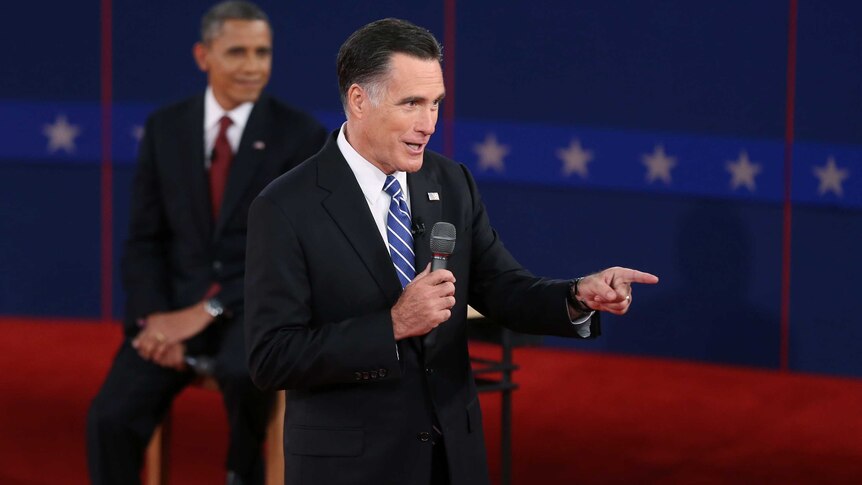 Barack Obama listens as Mitt Romney speaks at the second presidential debate.