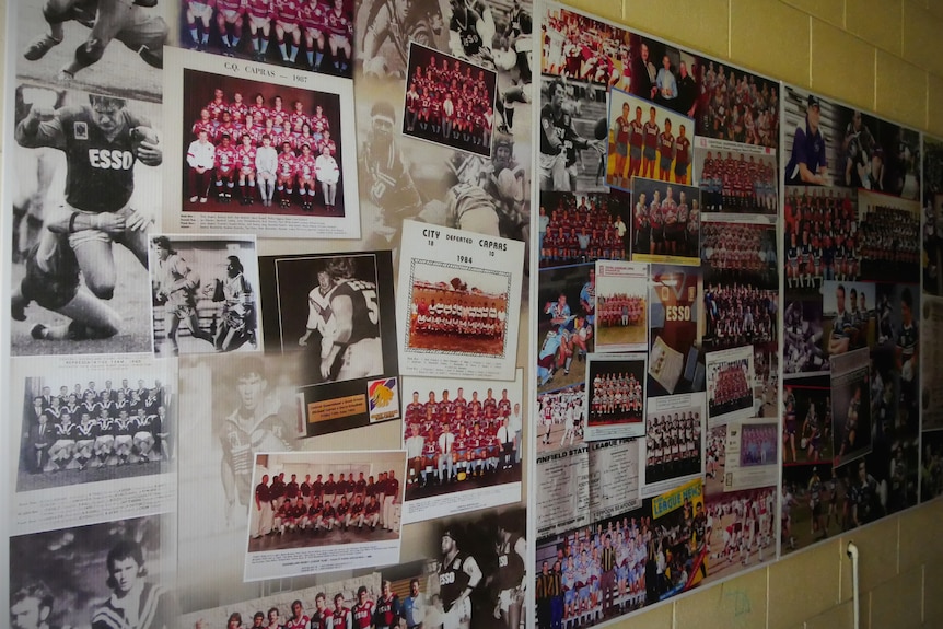 A wall of photos of rugby league players and teams