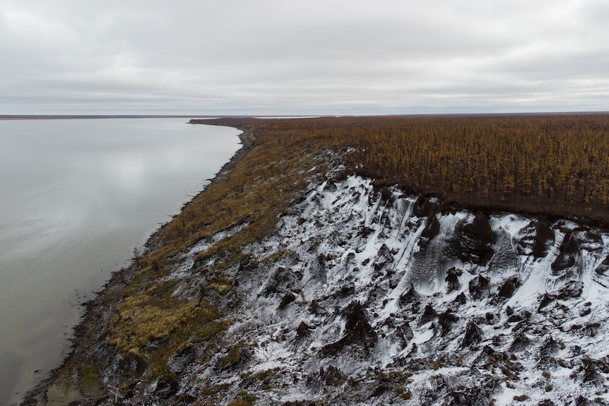 a view of the Duvanny Yar from the banks of the Kolyma River, showing melting permafrost