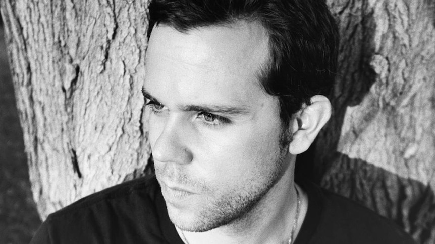 black and white photo of m83 staring into the distance
