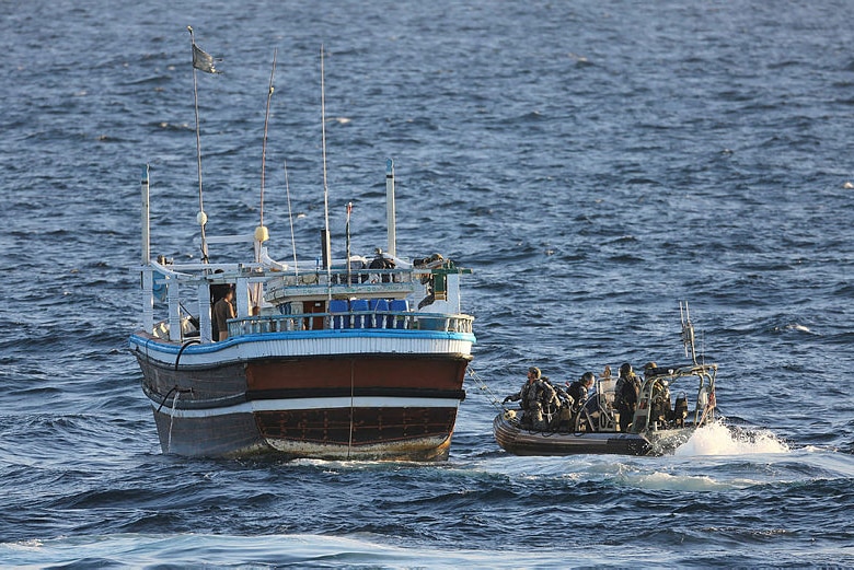 HMAS Warramunga's boarding team prepare to board a vessel of interest.