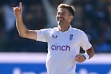 James Anderson celebrates with a his right hand in the air after taking his 7ooth Test wicket.
