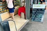 Bakery door and sign outside saying due to staff shortages will be closed every Monday