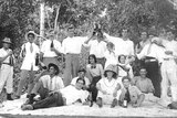 Black and white image of people in bush