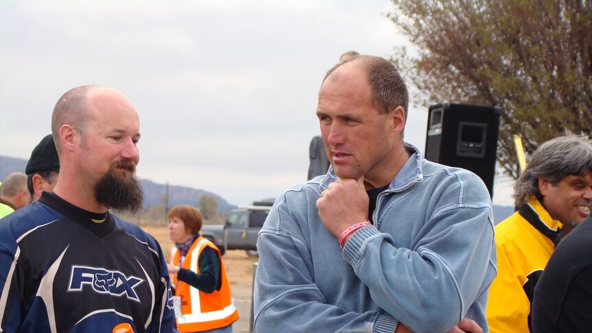 Tony Lockett lines up to sign in on Day One of the Finke Desert Race.