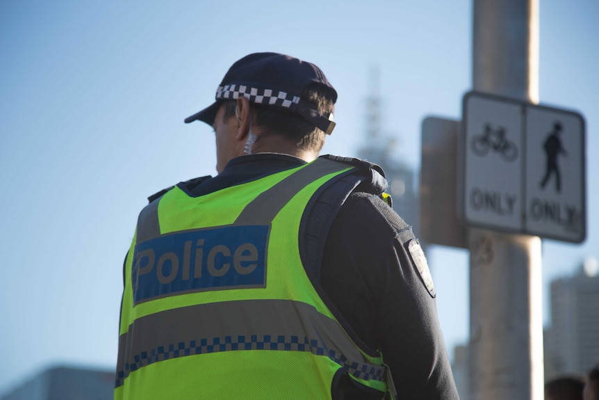 A Victoria Police officer wearing a fluro vest.