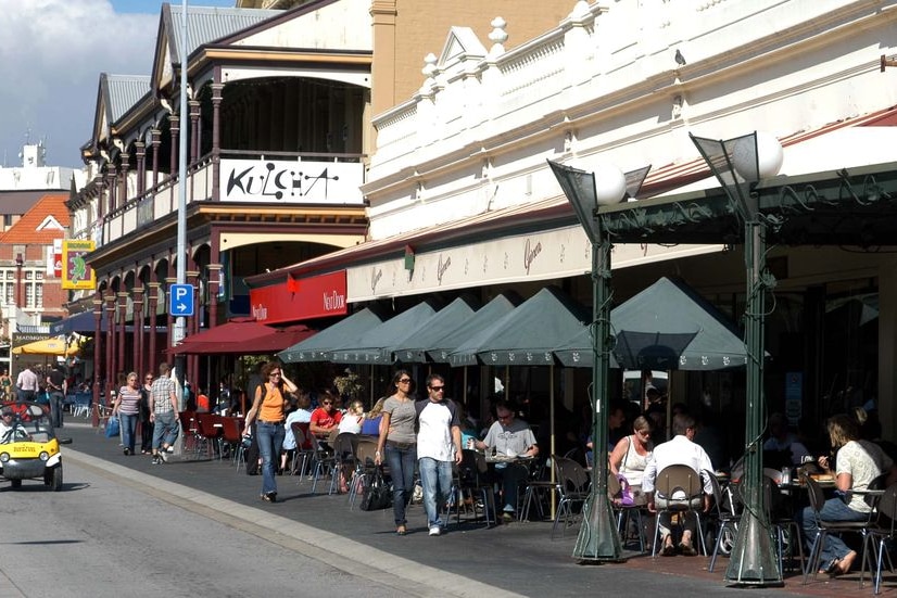 People make their way along Fremantle's South Terrace