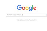 A snip of the Google search engine main search screen with 'is Google making us stupid' in the search field.