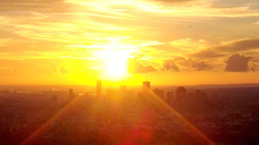 The sun's rays over Brisbane city