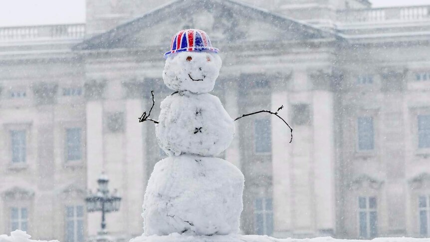 A snowman wears a Union Jack hat