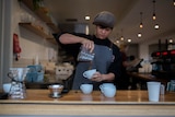 Barista Emma Bertoldi pouring coffee at Footscray cafe Rudimentary.