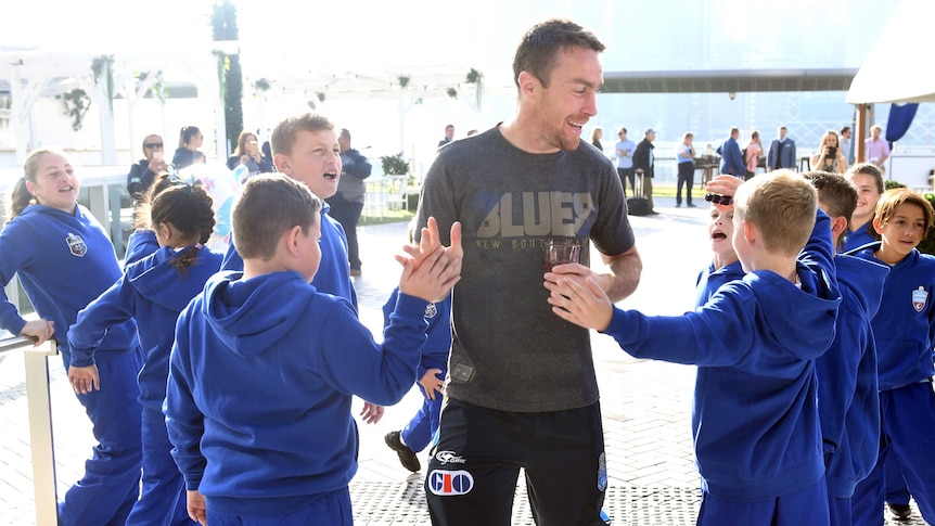 James Maloney hi-fives fans at NSW State of Origin announcement