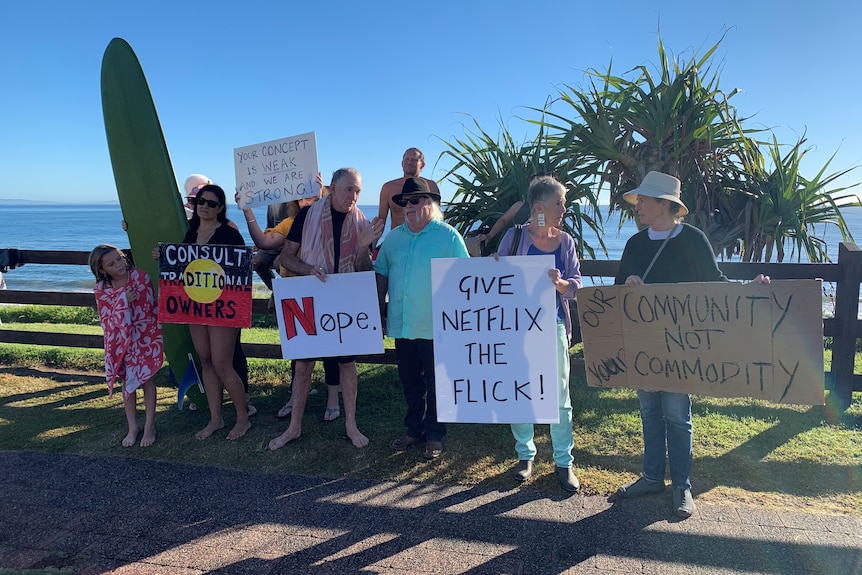 Protesters holding signs