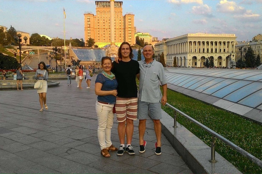 Three people standing in Kiev