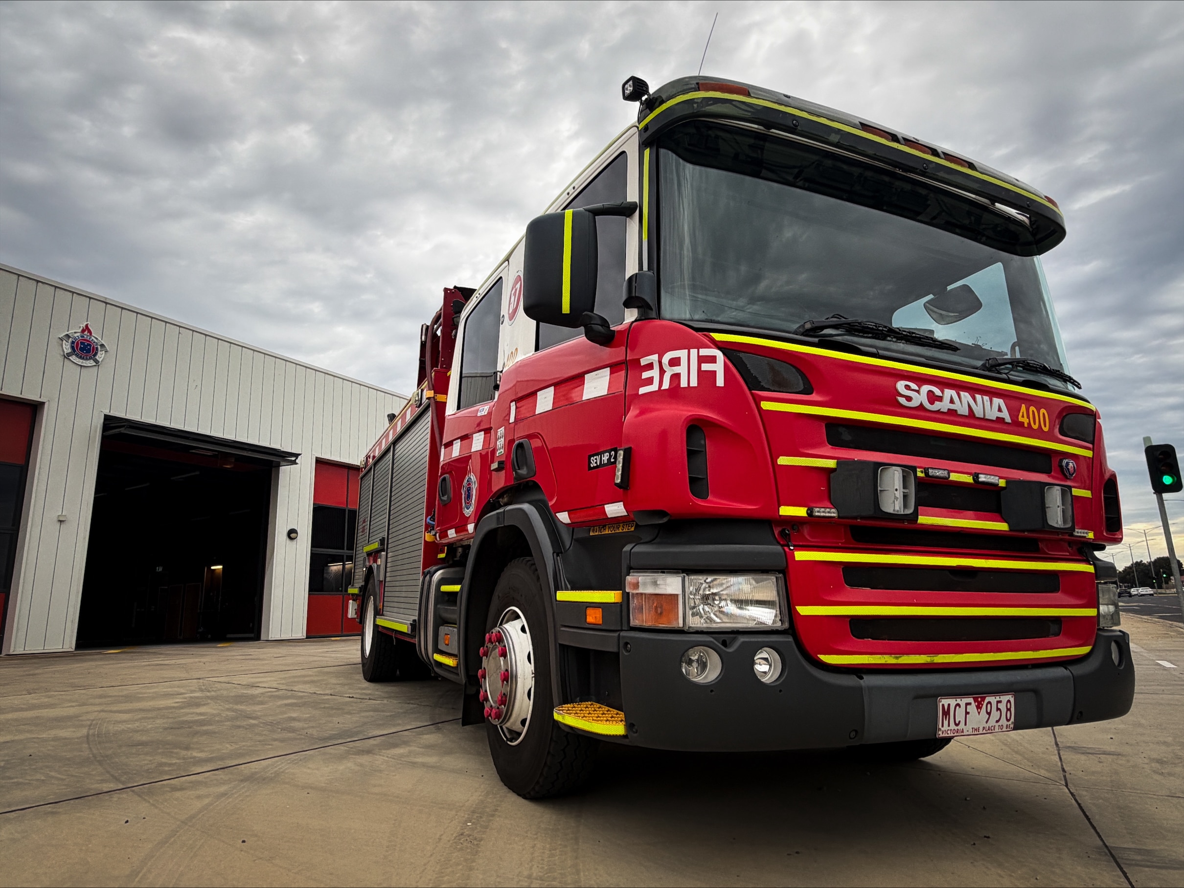 a firetruck parked at an outer suburban fire station.