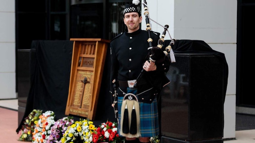 Canberra piper wearing tartan