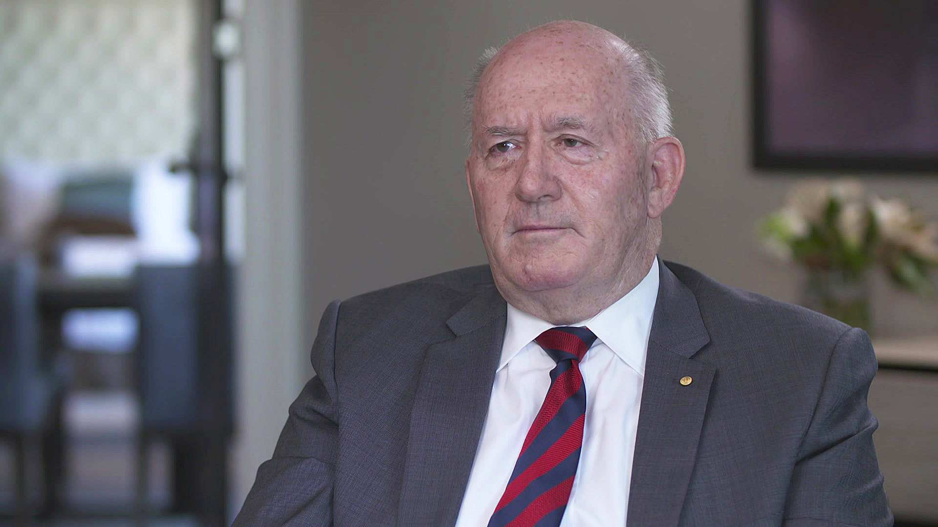 A man wears a suit and tie.