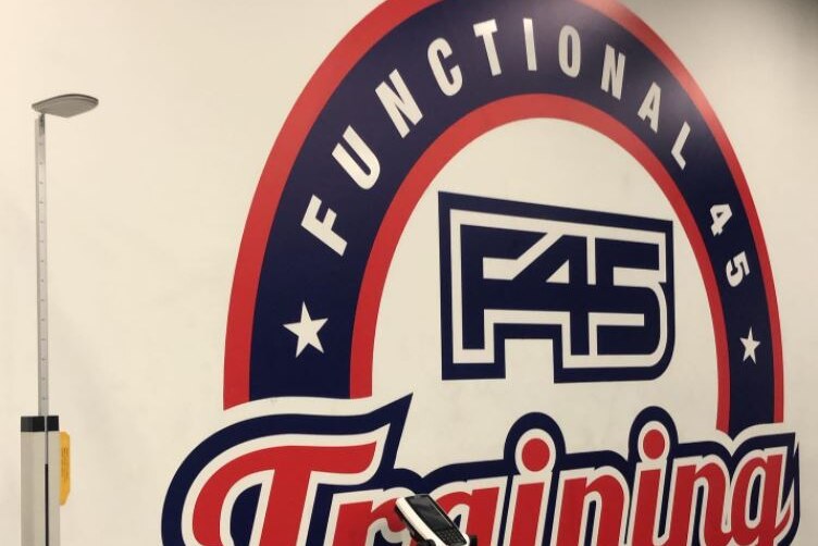 A F45 sign on a gym wall.