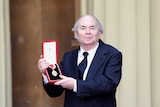 Sir Quentin Blake proudly holds his Knighthood after an the Investiture Ceremony at Buckingham Palace.