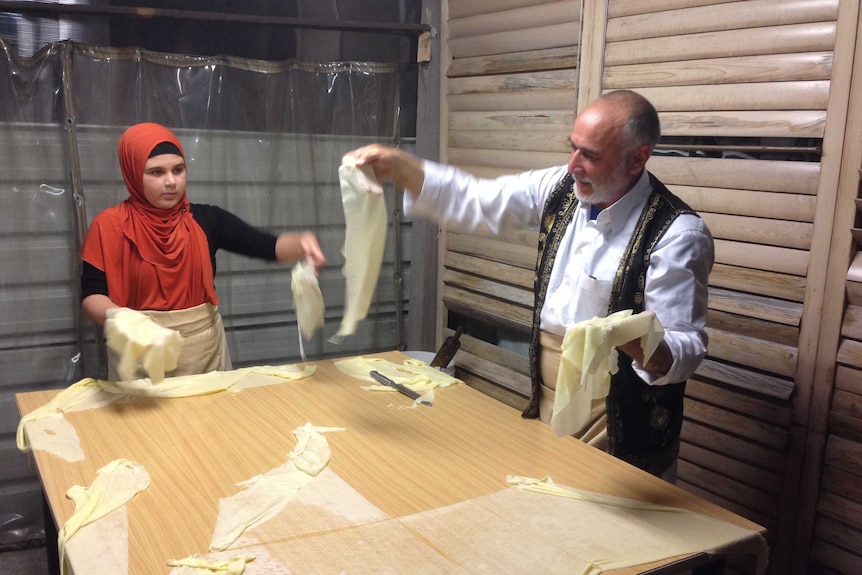 Nabil Omar makes a sweet cheese treat at the Ramadan food festival in Lakemba