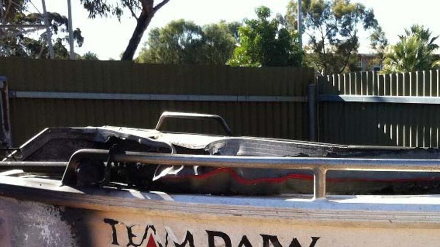 The burnt out boat was found south of Woomera.