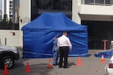 Police investigate woman's fatal balcony fall from a Gold Coast high-rise on August 8, 2014