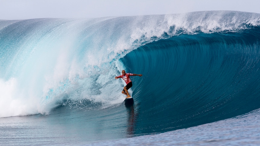 Stoked ... Kelly Slater rides to victory in Teahupoo.