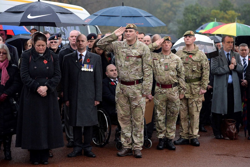 Mourners attend the funeral of World War II veteran Harold Percival.