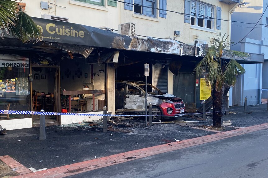 A charred and blackened shopfront.
