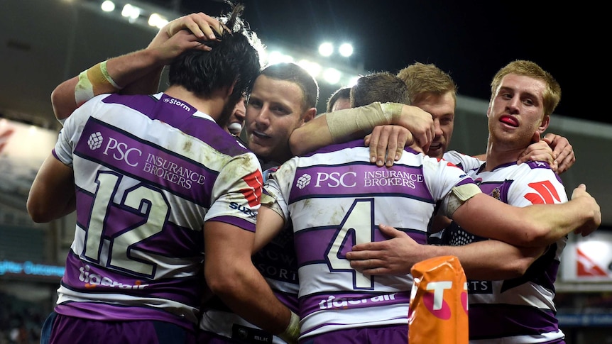 Melbourne Storm celebrate Mann try against Roosters