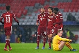Bayern players hug after a goal