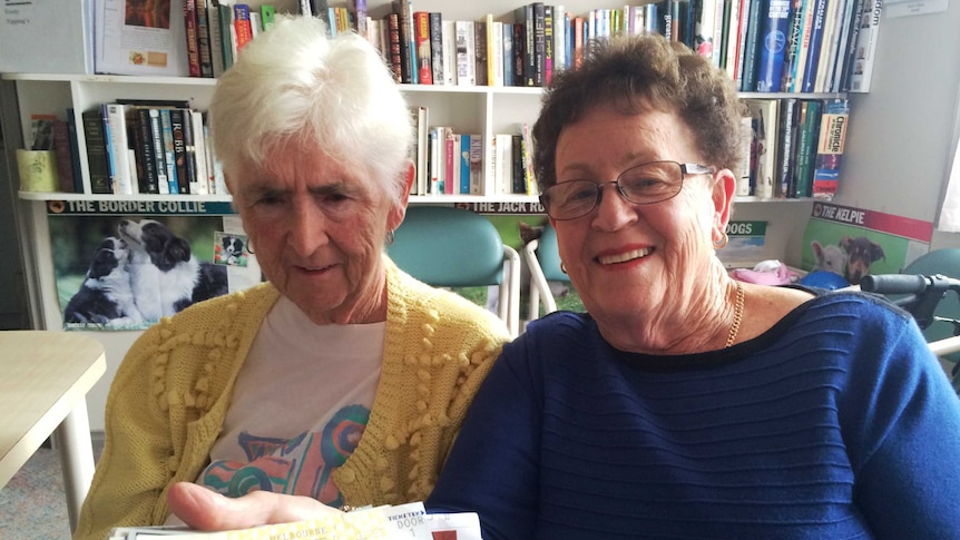 Val Lawson and Leslie Fitzpatrick hold up show tickets