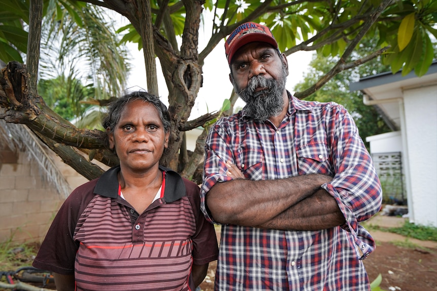 Woman and man staring at camera