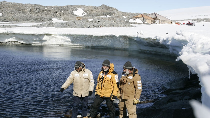 Expeditioners point to where they found Antarctica's first plane remains