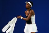Venus Williams throws her towel while taking on Li Na