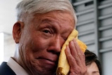 A close-up of Occupy Central pro-democracy movement founder Chu Yiu-ming as he cries.