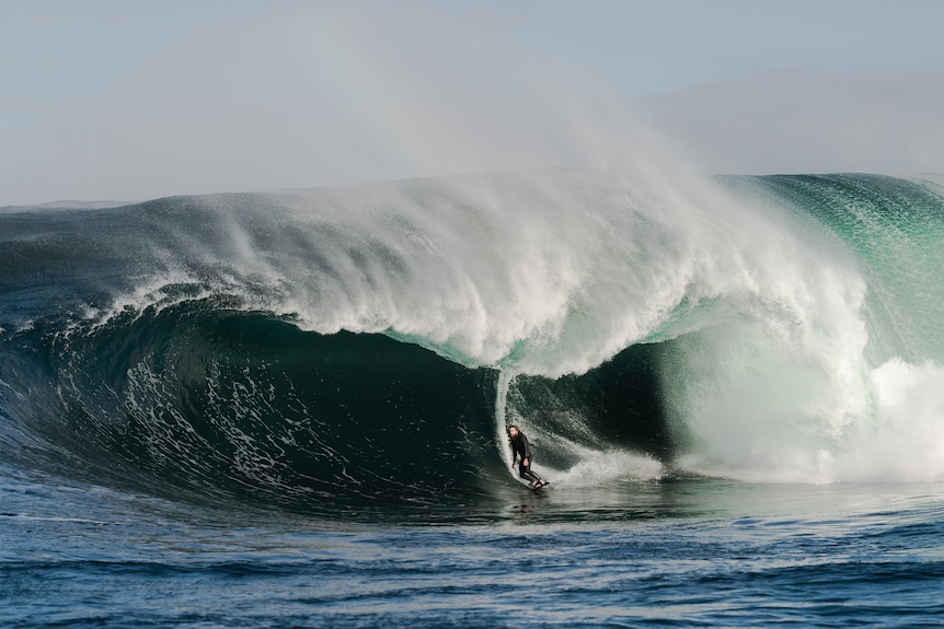 A surfer on a big wave.