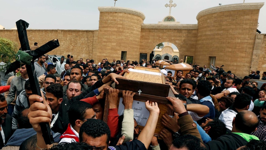 Relatives mourn for the victims of the Palm Sunday bombings.