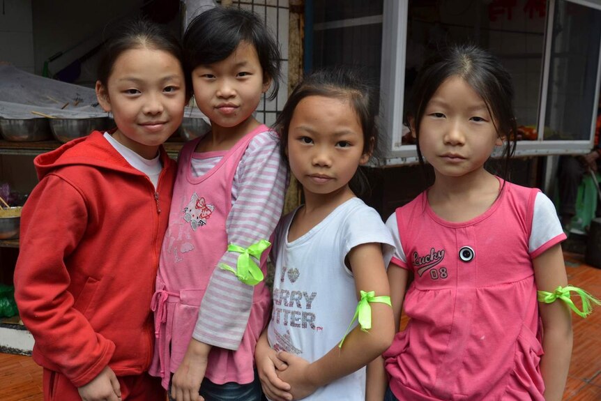 Young Chinese kids on a street in Guiyang.
