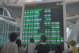 International passengers wait for postponed flights at Denpasar International Airport