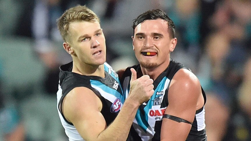 Robbie Gray and Sam Powell-Pepper have a hug.