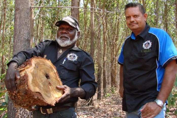 Gibson Farmer Illortaminni carries a log