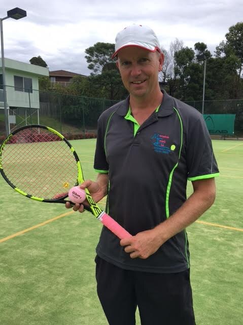 James Poso at a tennis court with a tennis racquet and pink ball
