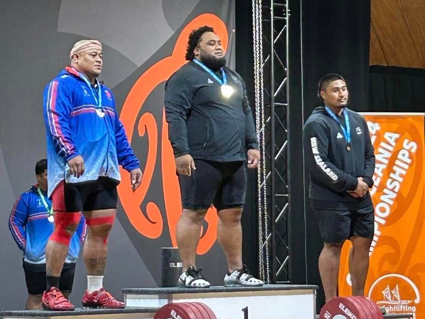 David Liti and Sanele Mao on the Oceania Weightlifting competition podium 
